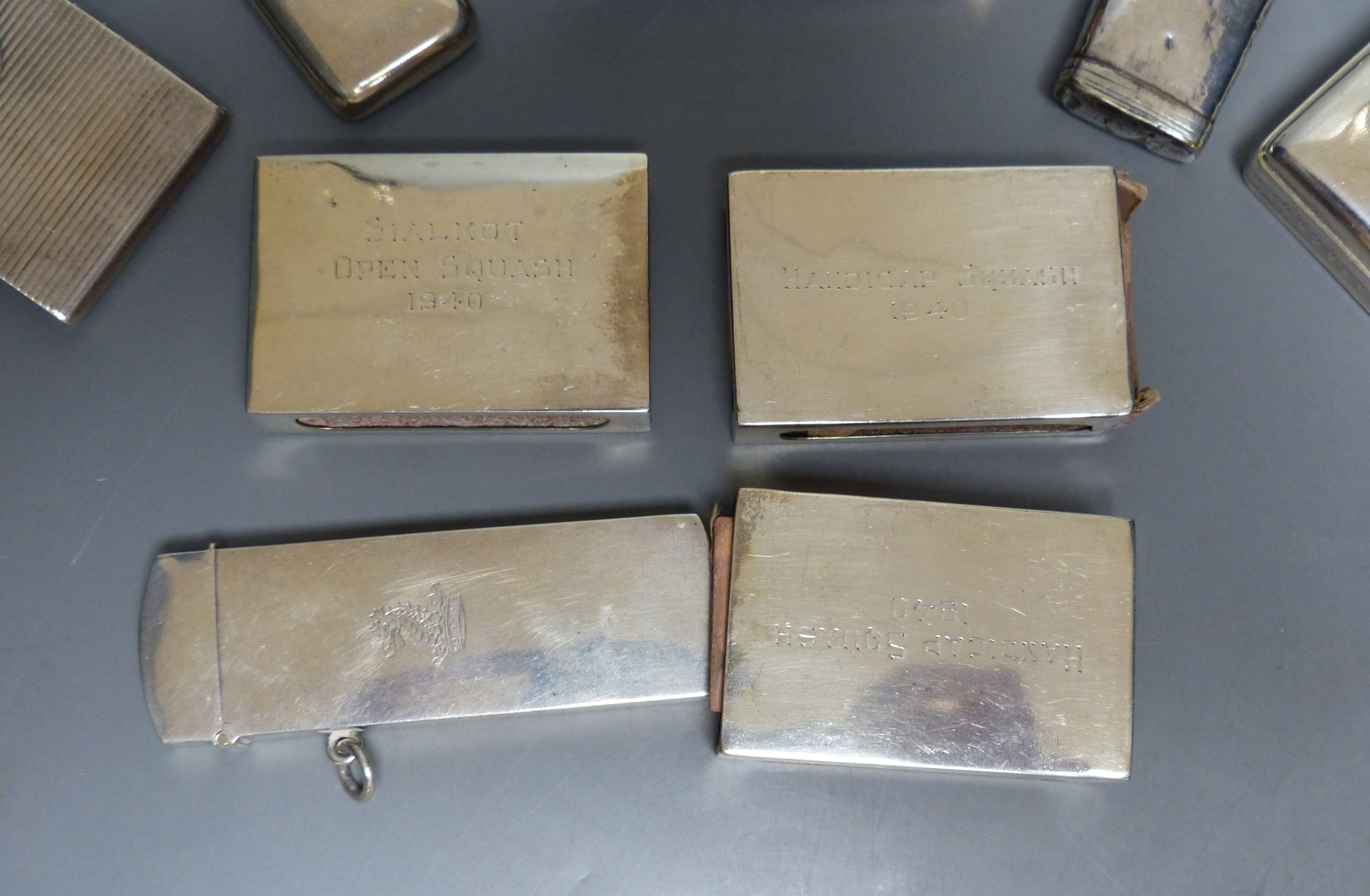 Two late Victorian silver diary cases, largest 85mm and seven other items including silver match sleeves & a silver fleam case.